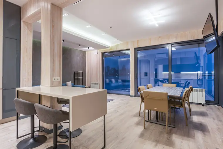 Dining area with laminate flooring, a table and chairs