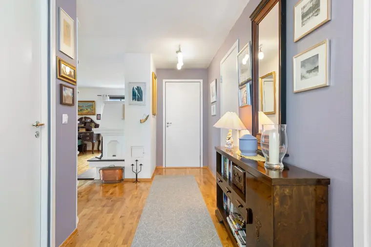 Hallway laid with parquet-pattern laminate flooring