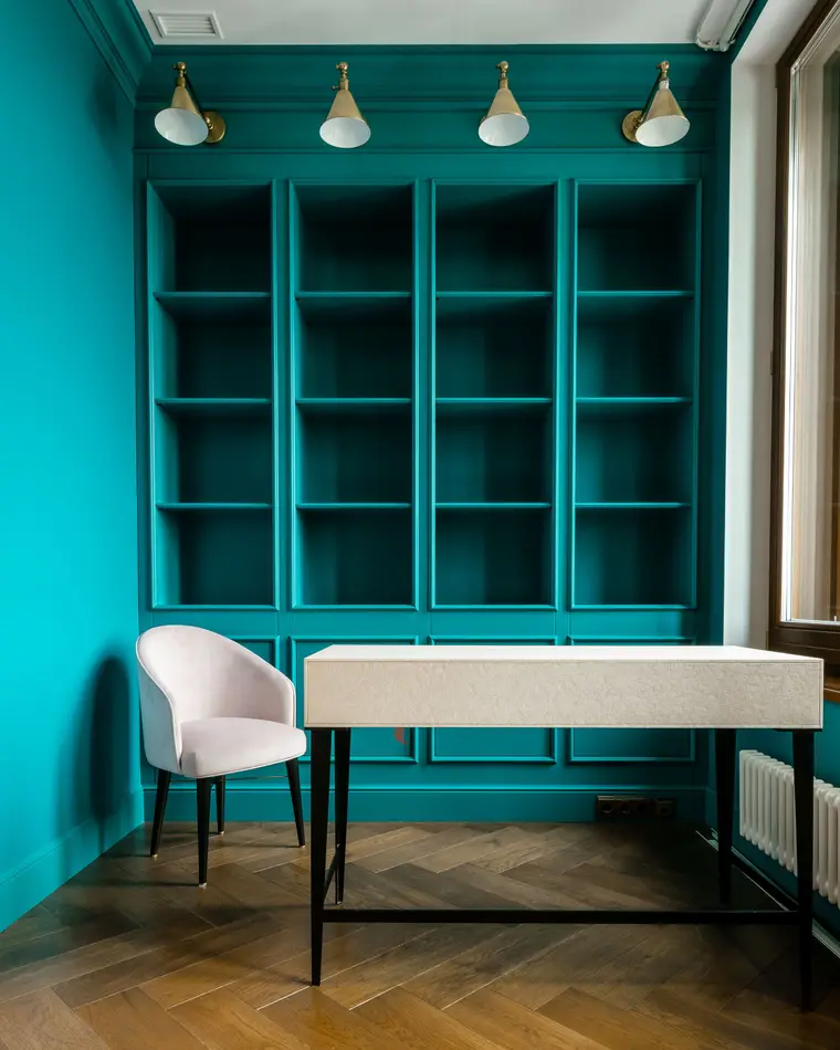 Room with luxury vinyl plank flooring and turquoise decor