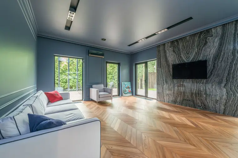 Living room with luxury vinyl plank laid in a chevron pattern
