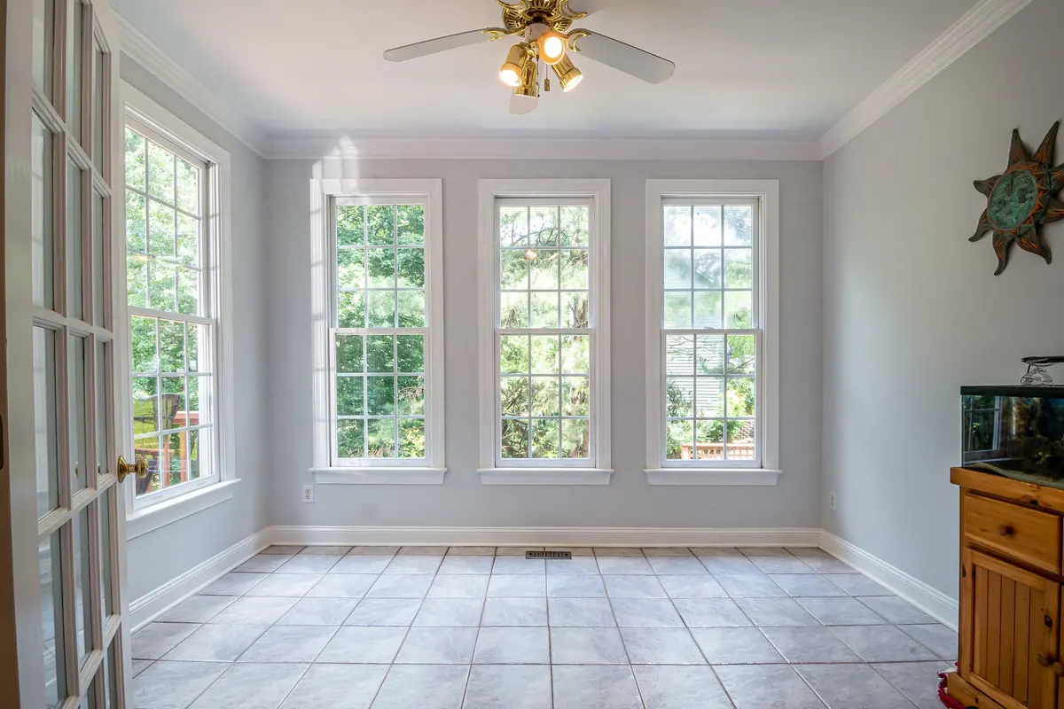 Spacious tiled room with large glass windows