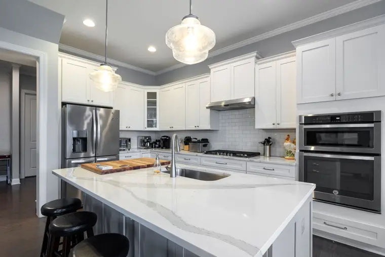 Contemporary kitchen with a large stone-topped island