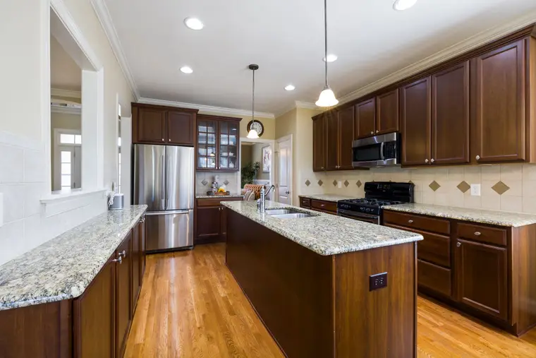 Modern kitchen with granite worktops and an island