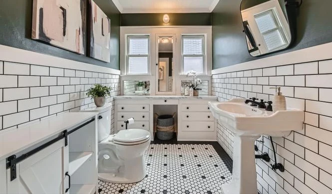 Bathroom with a black and white hex mosaic tile floor and subway tile walls