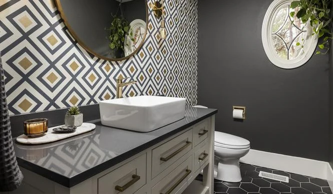Ensuite double vanity with plank flooring opening onto a carpeted bedroom