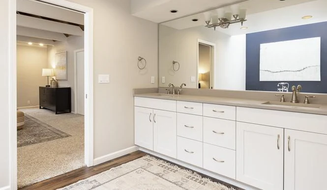 Powder room with a geometric feature wall and dark hex tile floor