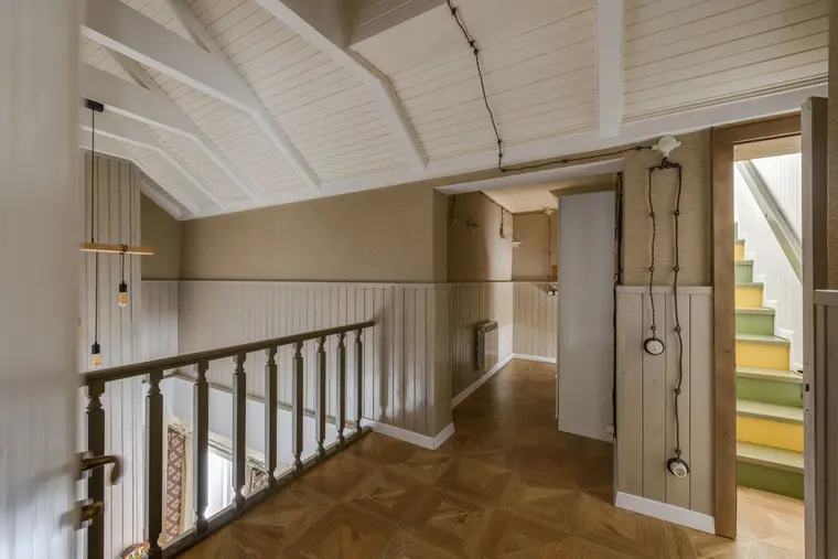 Hallway leading to a timber staircase