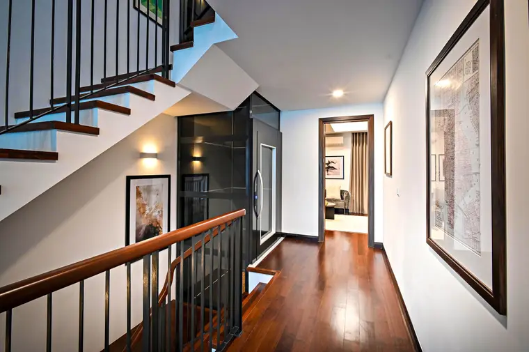 Corridor and staircase finished in matching wood-look flooring