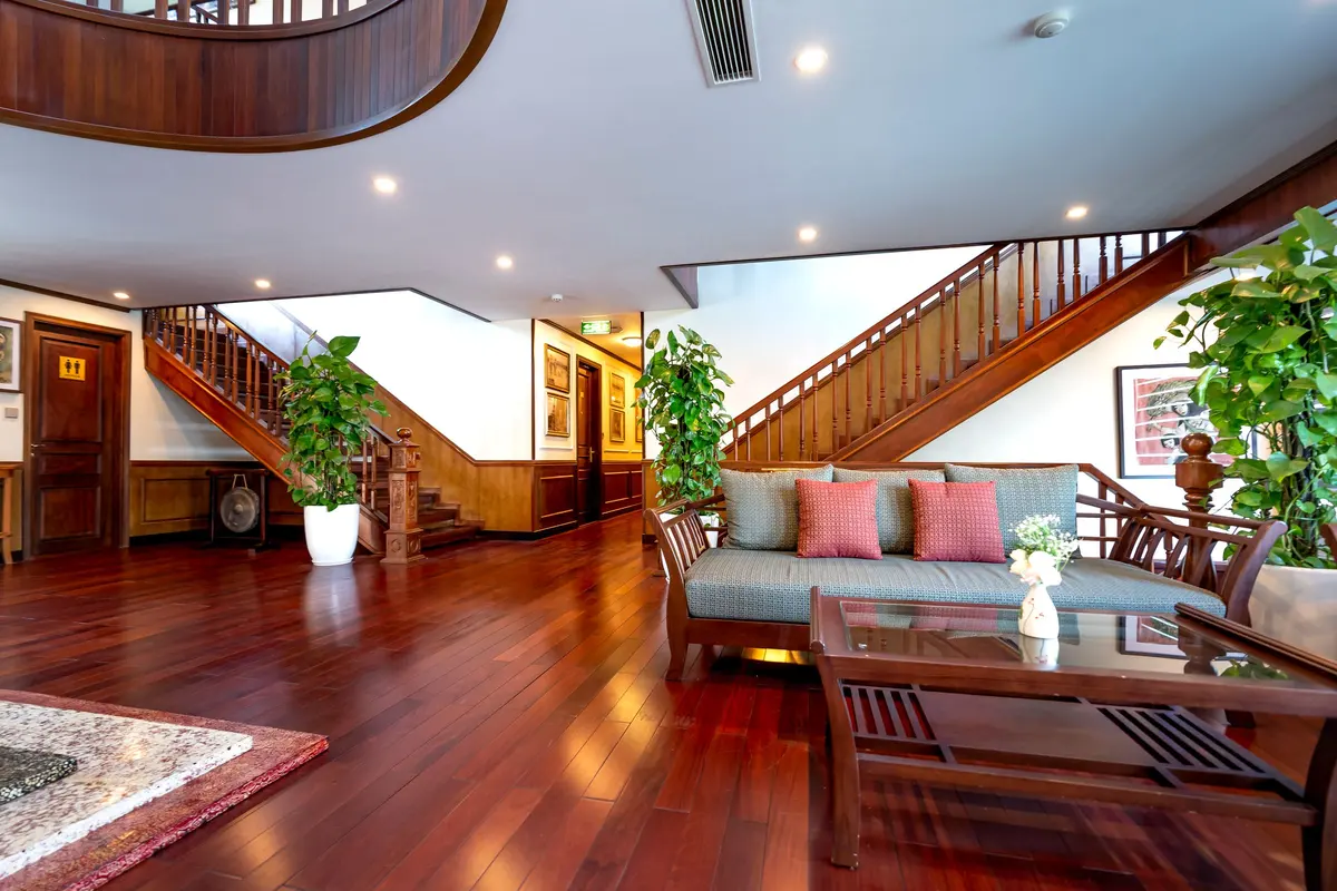 Open living space with wood-look flooring and an open staircase